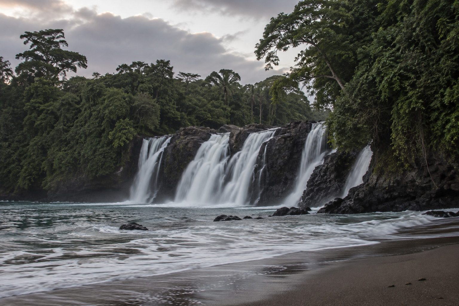 The Lobe falls pouring over rock directly into the Atlantic near Kribi